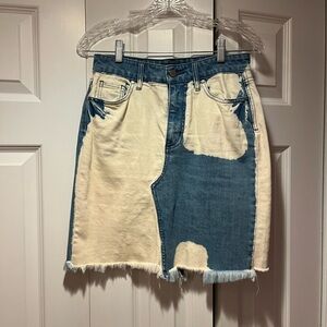 Blue and white skirt. Comes above the knee. Slit in back with 2 pockets.